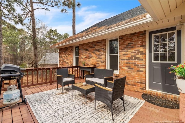 deck featuring area for grilling and outdoor lounge area