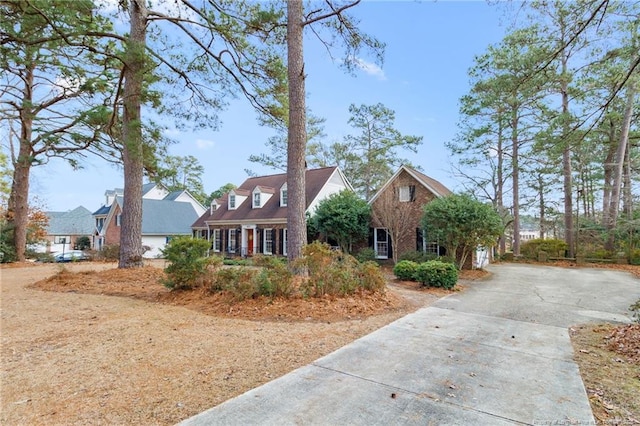 cape cod home with driveway