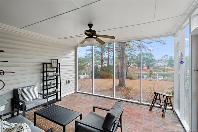 sunroom / solarium with a ceiling fan