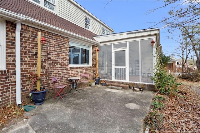 view of patio with a sunroom