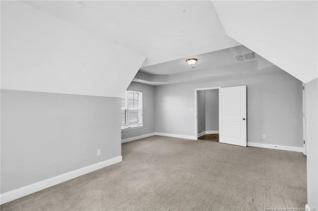 bonus room with carpet, baseboards, and visible vents