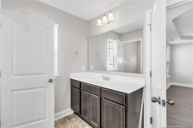 bathroom featuring baseboards and vanity