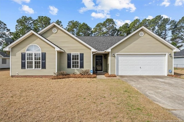 ranch-style home featuring concrete driveway, roof with shingles, a garage, and a front yard