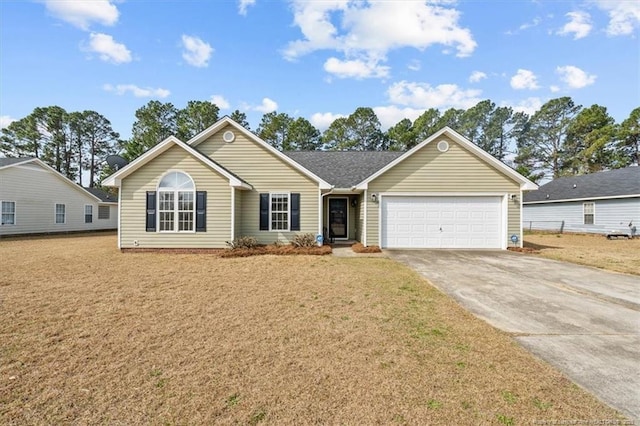 ranch-style home featuring a front yard, an attached garage, and driveway