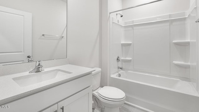 bathroom featuring toilet,  shower combination, and vanity