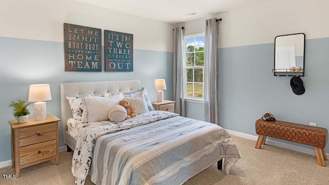 bedroom with carpet flooring and baseboards