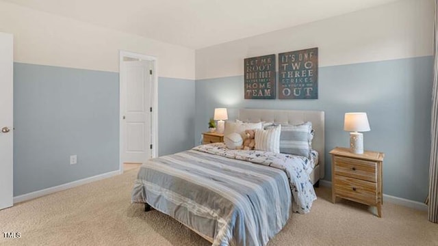 carpeted bedroom featuring baseboards