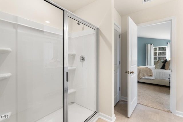 bathroom with visible vents, baseboards, a stall shower, and connected bathroom