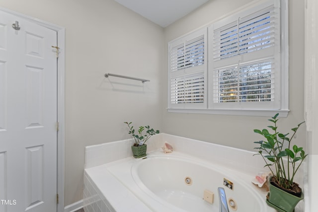 bathroom with a whirlpool tub