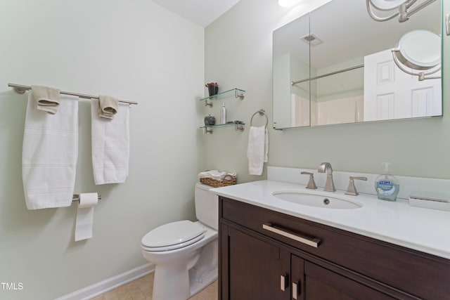 bathroom featuring vanity, baseboards, visible vents, walk in shower, and toilet