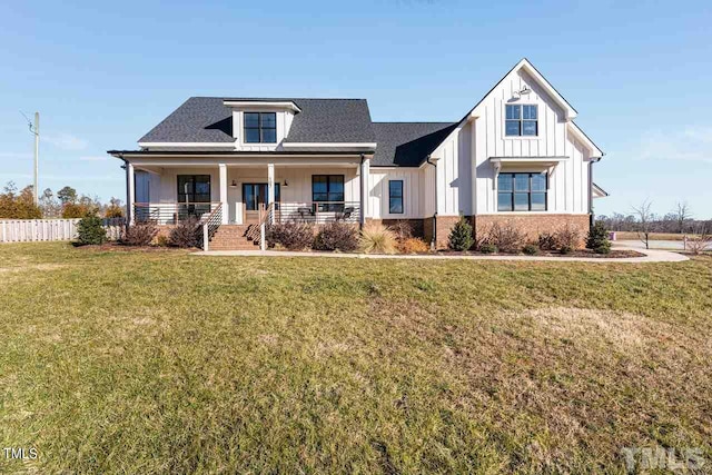 modern farmhouse style home featuring board and batten siding, a shingled roof, a front lawn, fence, and a porch