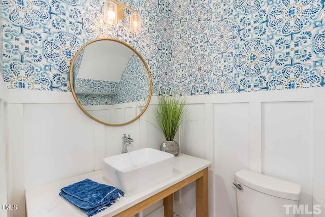 bathroom with vanity and toilet