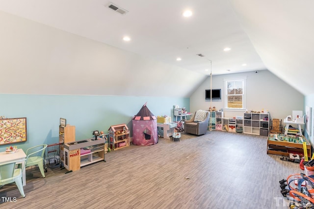 rec room featuring lofted ceiling, recessed lighting, wood finished floors, and visible vents