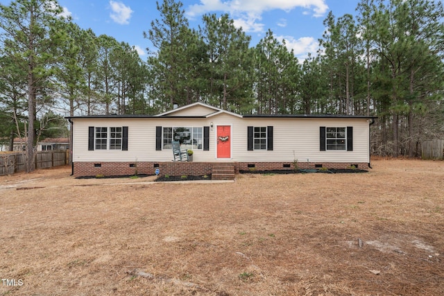 manufactured / mobile home with crawl space, entry steps, and fence