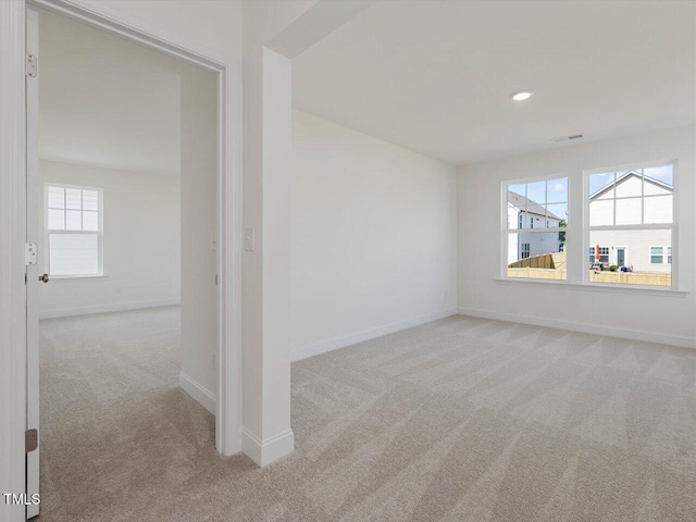 unfurnished room featuring recessed lighting, carpet, and baseboards