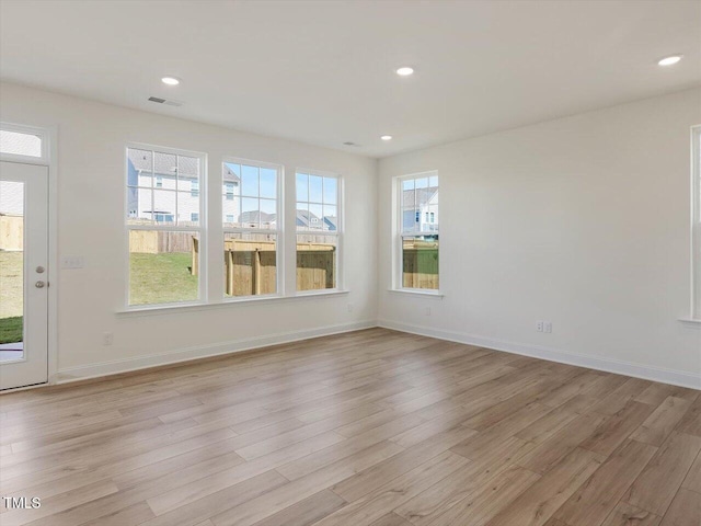 empty room with recessed lighting, visible vents, baseboards, and light wood-style floors