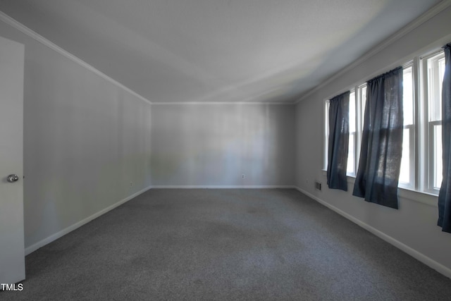 unfurnished room featuring visible vents, crown molding, baseboards, and carpet floors