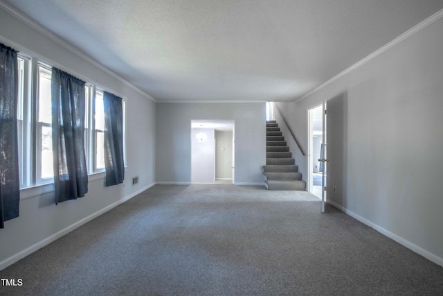 unfurnished living room with stairway, baseboards, carpet flooring, and crown molding