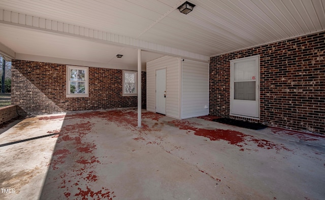 view of patio / terrace featuring an attached carport