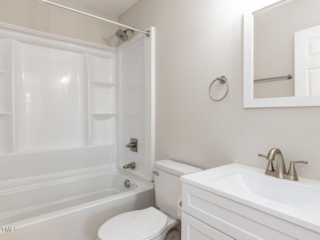 bathroom with vanity, toilet, and  shower combination