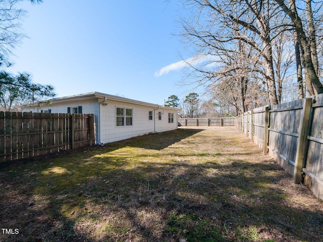 view of yard with a fenced backyard