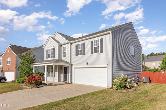 1009 Limeberry Ct, Clayton, NC 27520 - traditional-style house featuring a front lawn, a porch, central AC, concrete driveway, and a garage