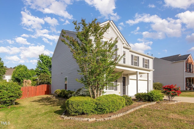 1009 Limeberry Ct, Clayton, NC 27520 - traditional-style home with fence, an attached garage, and a front yard