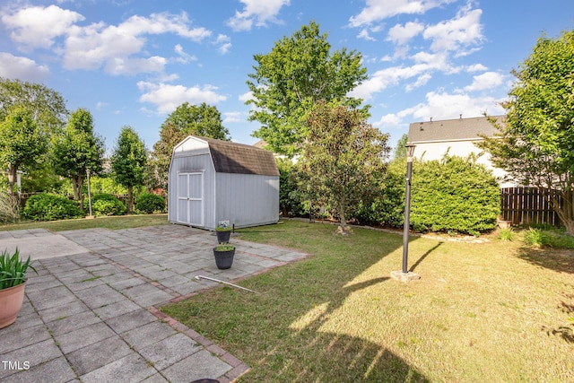 1009 Limeberry Ct, Clayton, NC 27520 - view of yard featuring a storage unit, a patio area, an outbuilding, and fence
