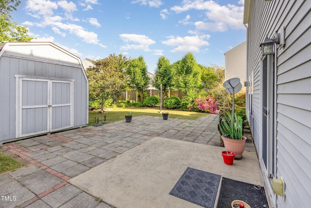 1009 Limeberry Ct, Clayton, NC 27520 - view of patio / terrace featuring fence, an outdoor structure, and a storage shed