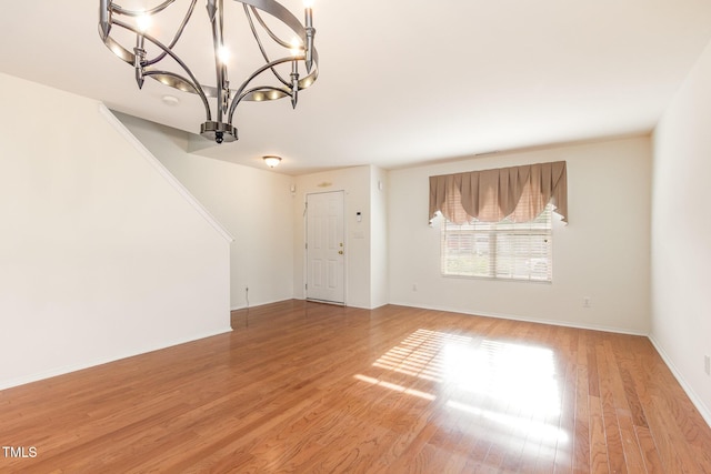 1009 Limeberry Ct, Clayton, NC 27520 - interior space with a chandelier, light wood finished floors, and baseboards