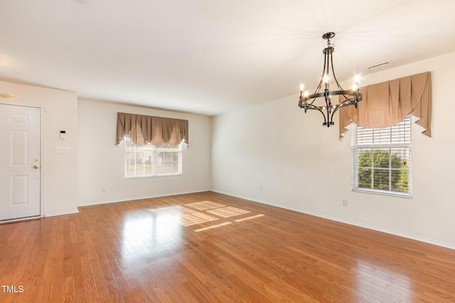 1009 Limeberry Ct, Clayton, NC 27520 - interior space featuring visible vents, a healthy amount of sunlight, and an inviting chandelier