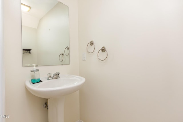 1009 Limeberry Ct, Clayton, NC 27520 - bathroom featuring vaulted ceiling and a sink