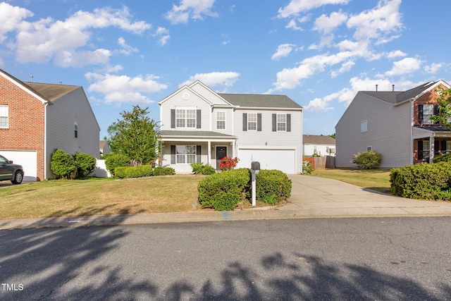 1009 Limeberry Ct, Clayton, NC 27520 - traditional home with driveway, a porch, a front yard, and a garage