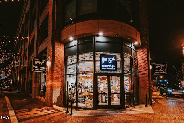 view of exterior entry at night