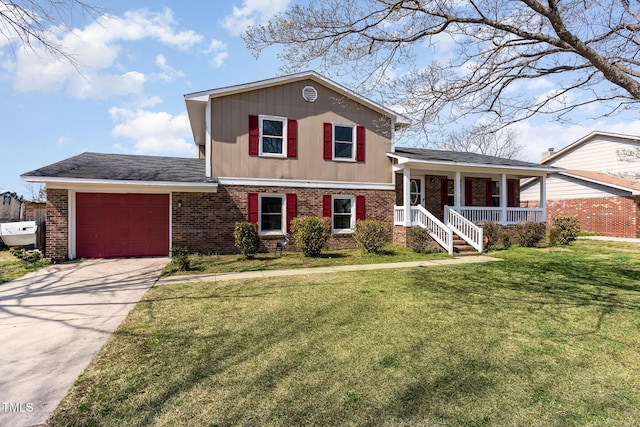 split level home with brick siding, driveway, a front lawn, and a garage