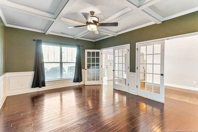 unfurnished room with wood finished floors, french doors, and coffered ceiling