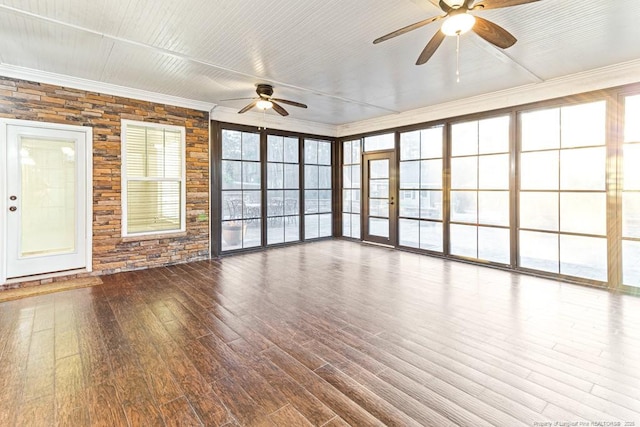 interior space featuring ornamental molding, a ceiling fan, and wood finished floors