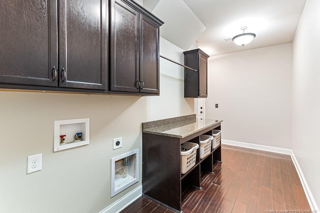 clothes washing area featuring dark wood-type flooring, baseboards, washer hookup, cabinet space, and hookup for an electric dryer