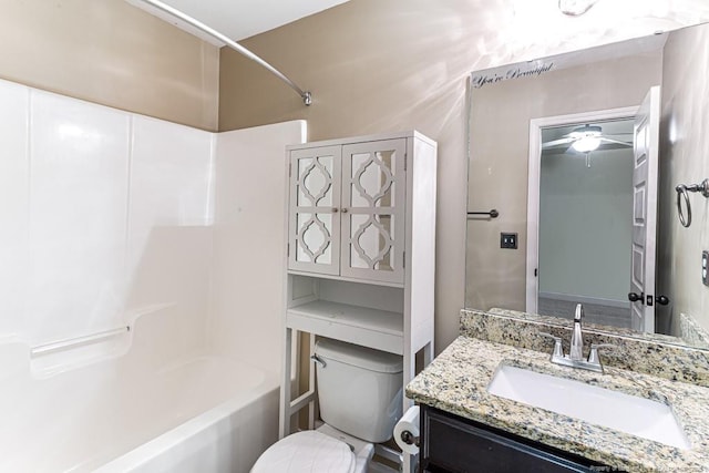 full bathroom featuring toilet, vanity, and shower / tub combination