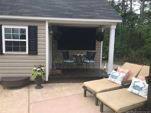 view of patio featuring fence