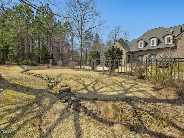 view of yard featuring a gate and fence