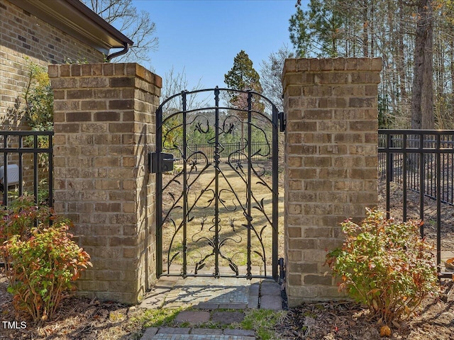 view of gate featuring fence