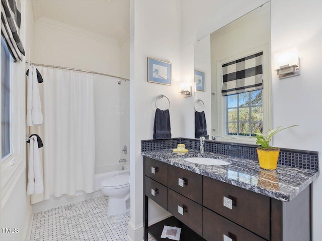 full bathroom with vanity, toilet, crown molding, and shower / tub combo