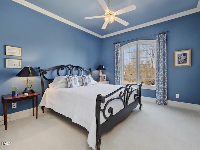 bedroom with carpet floors, a ceiling fan, baseboards, and ornamental molding