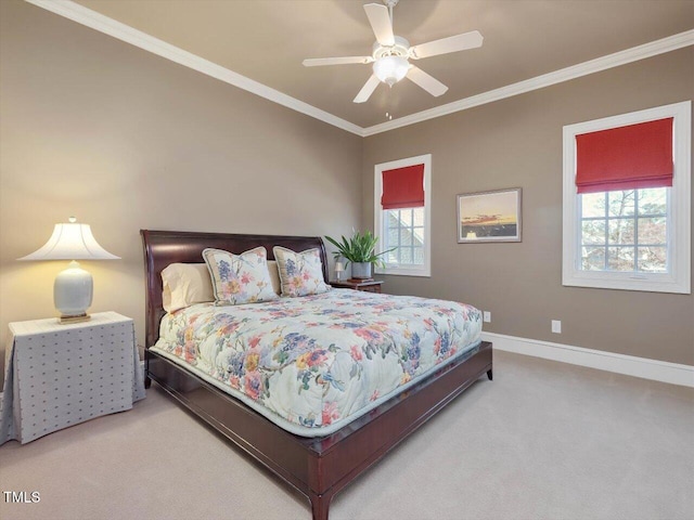 bedroom with ceiling fan, carpet, baseboards, and ornamental molding