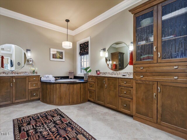 bathroom with two vanities and ornamental molding