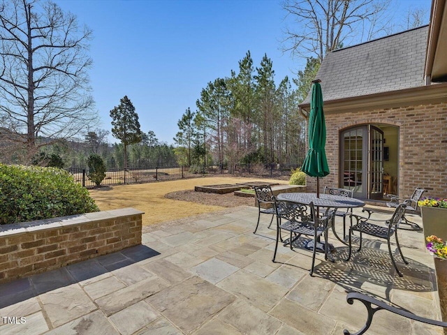 view of patio featuring a fenced backyard and outdoor dining space