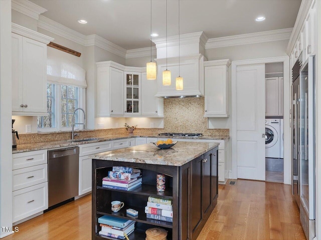 kitchen with light wood-style flooring, open shelves, white cabinetry, stainless steel appliances, and washer / dryer