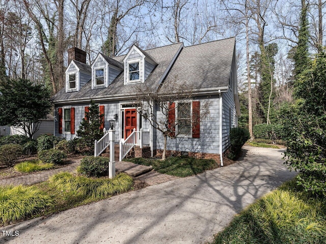 cape cod-style house featuring crawl space, driveway, and a shingled roof