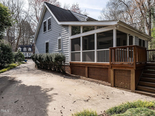 view of side of property with a sunroom